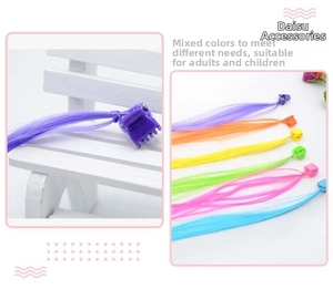 Close-up of colorful braided hair extensions for children with mini claw clips