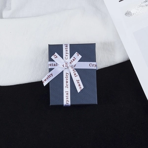 Deep grey jewelry gift box with a white silk ribbon bow for rings and necklaces