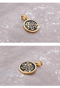 Macro detail of oval elephant pendant in golden finish with black enamel inlay