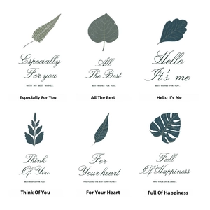 Six minimalist greeting card designs featuring botanical leaf illustrations and golden text