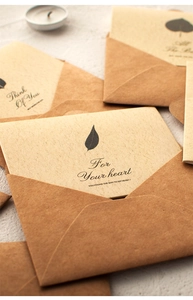 Detail of kraft paper mini envelopes and cards with printed heartfelt messages