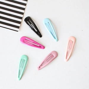 Set of six colorful matte metal snap hair clips for women on a minimalist white background