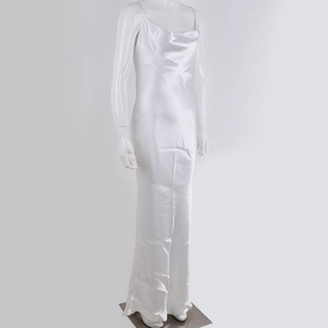 Elegant white satin long slip dress with an open back design on a mannequin display
