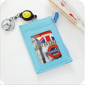 Light blue Saffiano leather card holder with ID window, zipper pocket and smiley puller