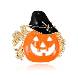 Detailed view of Halloween pumpkin brooch featuring a black wizard hat and orange enamel finish