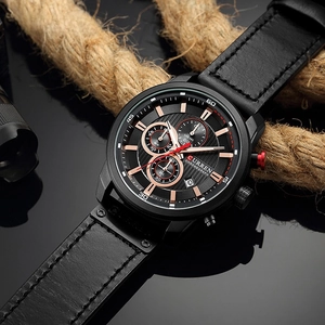 Detailed macro shot of business chronograph watch with leather strap on rustic rope background