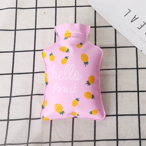 Pink mini PVC hot water bottle with pineapple design and Hello Fruit text on grid background