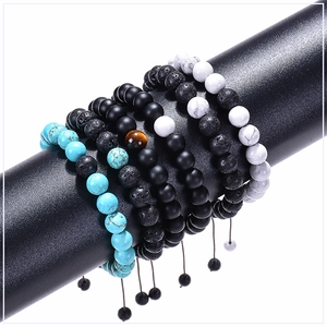 Detail of 8mm lava rock and turquoise bead bracelets with adjustable braided cords