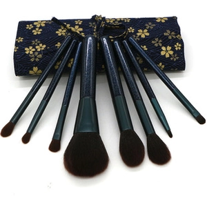 Detail of 8pcs eye makeup brush set with dark blue glitter handles and a floral pouch