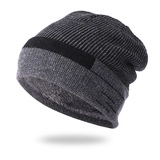 Detail of striped knit beanie showing thick texture and warm plush fleece lining