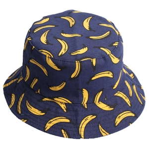Navy blue reversible canvas bucket hat with all-over yellow banana fruit print pattern