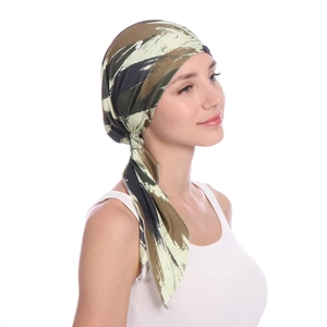 Detail of camouflage print headscarf with long straps showing fabric texture and design