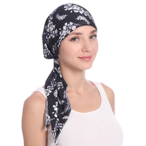 Detail of floral print headwrap featuring side tie design and elastic soft fabric