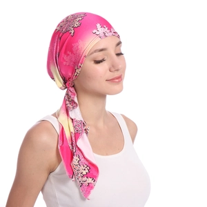 Close-up of pink gradient floral headwrap with long ties in high-quality silk finish