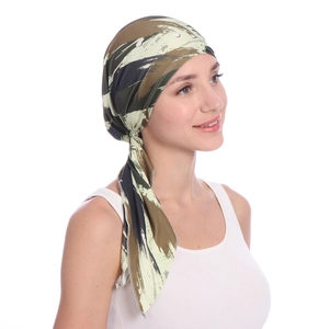 Detail of camouflage print headscarf showing long tail straps and stretch fabric texture