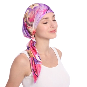 Detailed side view of bohemian headwrap featuring vibrant purple and pink floral butterfly patterns