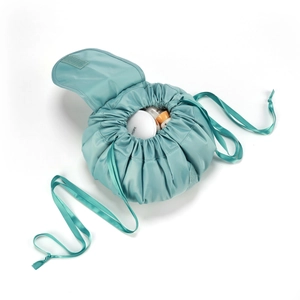 Large drawstring makeup bag in mint green waterproof fabric with portable round design