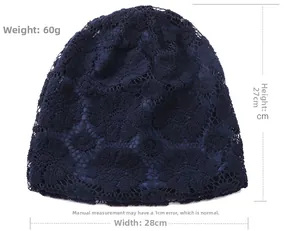 Detail view of navy lace slouchy beanie showing dimensions 28x27cm and 60g weight