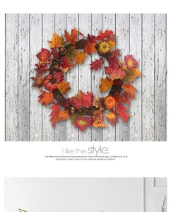 Detail view of autumn wreath with maple leaves and pumpkins on rustic wood wall