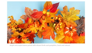 Close-up of autumn wreath with maple leaves, orange berries, and small pumpkins