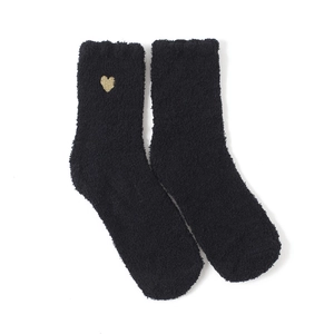 Detail of black coral fleece slipper sock featuring delicate golden heart embroidery