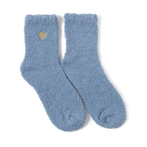 Detail of blue coral fleece socks with golden heart embroidery on soft plush fabric
