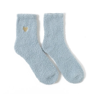 Close-up of light blue coral fleece socks with small golden heart embroidery