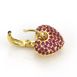 Detail of gold-plated copper earrings with micro-set magenta heart-shaped zircons