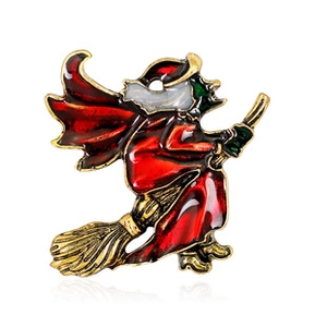 Detail of whimsical witch on broomstick brooch with colorful enamel and gold-plated finish