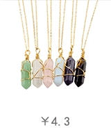 Detail view of six hexagon crystal point pendants wrapped in gold wire with thin chains