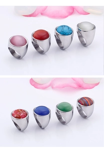 Macro detail of various colorful opal and turquoise gemstones set in steel rings