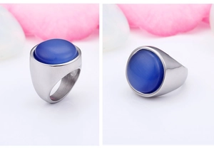 Macro view of blue cat-eye stone inlay on brushed silver titanium steel ring for women