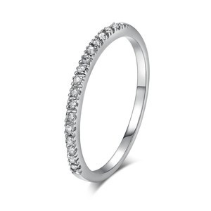 Close-up of a silver half-eternity ring featuring delicate micro-pave zircon stones