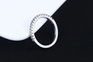 Macro detail of the 18K GP engraving and micro-paved zircons on a silver-tone ring