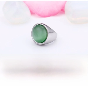 Close-up of rust-resistant stainless steel ring with a round green cat eye stone