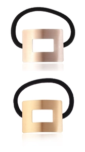 Detailed view of rectangular hollow brushed metal hair ties in gold and rose gold