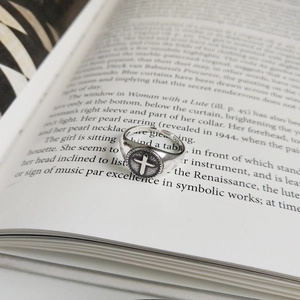 Macro view of vintage S925 sterling silver open ring with cross and engraved hallmark