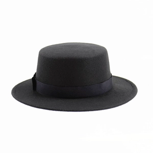 Detailed close-up of a classic black wool flat-top boater hat with a satin ribbon band