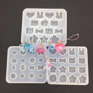 DIY silicone mold set for resin pendants featuring cute rabbit star and strawberry shapes