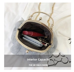 Internal view of grey faux fur bag showing capacity for wallet and cosmetics