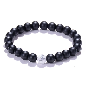 Black matte 8mm natural stone beads bracelet with single white turquoise accent piece