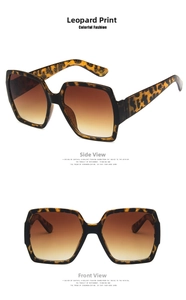 Detailed view of oversized square leopard print sunglasses with brown gradient lenses