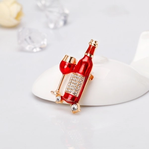 Elegant gold wine bottle brooch with red enamel and sparkling crystal rhinestones