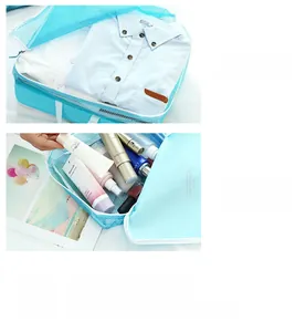 Detail of blue travel organizers showing mesh design for shirts and toiletries