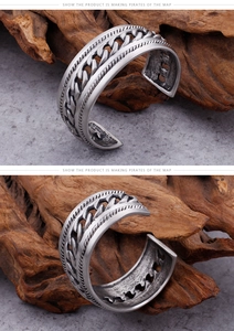 Detailed macro view of vintage titanium steel chain link cuff bracelet with oxidized finish