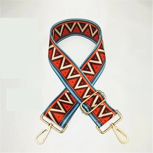Close-up of colorful ethnic geometric woven strap with gold metal buckles and adjuster