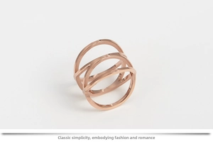 Detail of rose gold bird nest ring with a multilayer intertwined minimalist hollow design