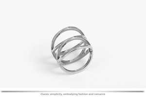 Detailed view of interconnected three-ring nest design in polished stainless steel