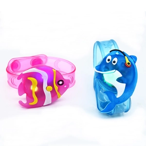 Glow-in-the-dark cartoon fish wristbands for kids in pink and blue plastic with LED lights