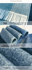 Macro detail of soft blue and white plaid cashmere-like fabric with long fringe tassels